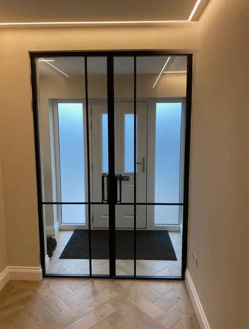 Made-to-measure black steel and glass double loft doors