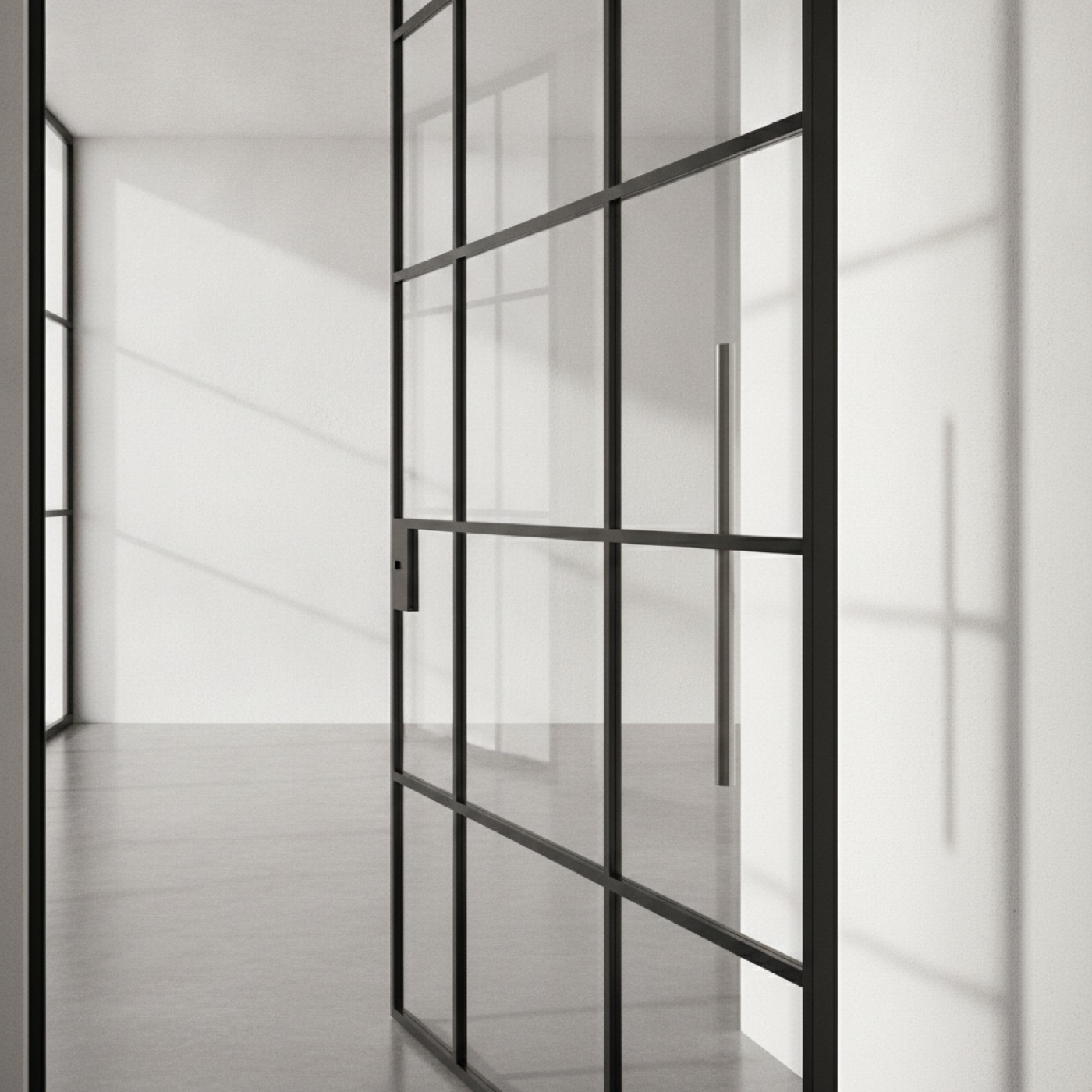 Slim black steel glazing bars with a long brushed steel door handle